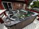 Close-up of a filled hot tub on a wooden deck, ready for relaxation at 180 Pine Grove Ct, Daytona Beach, FL 32119