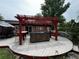 Outdoor hot tub on a wooden deck with a red pergola and seating nearby at 180 Pine Grove Ct, Daytona Beach, FL 32119
