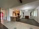 Open floorplan from a living room featuring a breakfast bar area to a full kitchen and dining area at 180 Pine Grove Ct, Daytona Beach, FL 32119