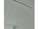 Simple attic access panel in the ceiling provides entry for maintenance and storage at 1821 Talmadge St, Deland, FL 32724