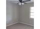 Bedroom with ceiling fan and window at 1821 Talmadge St, Deland, FL 32724