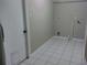 Practical laundry room with tile flooring, ready for customization to meet your specific needs at 1821 Talmadge St, Deland, FL 32724