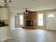 Inviting living room with a brick fireplace, neutral paint, tile floors, and a ceiling fan at 1821 Talmadge St, Deland, FL 32724