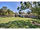 Large backyard with mature trees, showcasing the home's privacy and outdoor space at 1828 West Pkwy, Deland, FL 32724