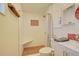 Bright bathroom featuring a walk-in shower with tile accents, modern fixtures and convenient shelf space at 1828 West Pkwy, Deland, FL 32724