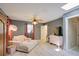 Inviting bedroom featuring a cozy daybed, skylight, stylish decor, and neutral flooring at 1828 West Pkwy, Deland, FL 32724