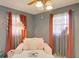 Stylish bedroom featuring a comfortable daybed, soft pink pillows, and abundant natural light at 1828 West Pkwy, Deland, FL 32724