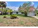 Charming single-story home with lovely landscaping and a well-manicured lawn at 1828 West Pkwy, Deland, FL 32724