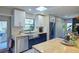 Modern kitchen with stainless steel appliances, butcher block island, and ample storage at 1828 West Pkwy, Deland, FL 32724