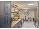 Butcher block countertops and stainless steel appliances in a remodeled, open concept kitchen and dining area at 1828 West Pkwy, Deland, FL 32724