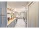 Beautiful kitchen featuring blue cabinets, butcher block countertops, and modern appliances at 1828 West Pkwy, Deland, FL 32724