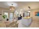 Open kitchen, dining and living area with stylish furnishings and lots of natural light at 1828 West Pkwy, Deland, FL 32724