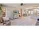Bright living room and dining area with a rustic style and decorative windmill feature at 1828 West Pkwy, Deland, FL 32724