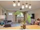 Well-lit open living room with hardwood floors, stylish decor, and a comfortable seating area at 1828 West Pkwy, Deland, FL 32724