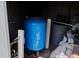 Indoor well water pressure tank and plumbing equipment in a storage area at 1828 West Pkwy, Deland, FL 32724