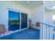 Cozy balcony seating with scenic views and a sliding door entrance to the condo at 2 Oceans West Blvd # 305, Daytona Beach, FL 32118