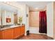 Well-lit bathroom with a large mirror, vanity, and shower-tub combination at 2 Oceans West Blvd # 305, Daytona Beach, FL 32118