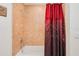 Close up on a shower tub with a red curtain at 2 Oceans West Blvd # 305, Daytona Beach, FL 32118