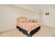 Comfortable bedroom featuring neutral decor and a view to the doorway at 2 Oceans West Blvd # 305, Daytona Beach, FL 32118