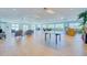 Spacious community room with seating areas, dining tables, and ample natural light at 2 Oceans West Blvd # 305, Daytona Beach, FL 32118