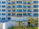 Beautiful condo building featuring private balconies and tropical landscaping in a desirable location at 2 Oceans West Blvd # 305, Daytona Beach, FL 32118