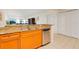 Kitchen area with granite counters, stainless steel dishwasher, and bright lighting at 2 Oceans West Blvd # 305, Daytona Beach, FL 32118