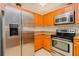 Modern kitchen with stainless steel appliances, granite countertops, and light wood cabinets at 2 Oceans West Blvd # 305, Daytona Beach, FL 32118