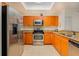 Bright kitchen featuring stainless steel appliances, granite countertops, and ample cabinet space at 2 Oceans West Blvd # 305, Daytona Beach, FL 32118