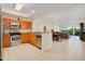 Open floor plan featuring kitchen with stainless steel appliances, tile floors, dining area, and living room at 2 Oceans West Blvd # 305, Daytona Beach, FL 32118