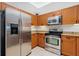 Well-equipped kitchen featuring stainless steel appliances and granite countertops at 2 Oceans West Blvd # 305, Daytona Beach, FL 32118