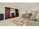 Comfortable living area with large entertainment center, tile flooring and an open layout at 2 Oceans West Blvd # 305, Daytona Beach, FL 32118