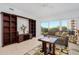 Comfortable living space with entertainment center, seating, and balcony with views at 2 Oceans West Blvd # 305, Daytona Beach, FL 32118