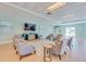 Inviting lounge with comfortable seating, a large TV, and a stylish rug at 2 Oceans West Blvd # 305, Daytona Beach, FL 32118