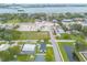 Drone shot of a cozy home nestled near local businesses and waterway at 203 Fox Pl, Port Orange, FL 32127