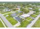 Aerial shot showing the home's location near a large body of water and businesses at 203 Fox Pl, Port Orange, FL 32127
