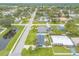 Community aerial view of a home near a pond and well-maintained neighborhood streets at 203 Fox Pl, Port Orange, FL 32127