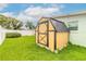 Backyard featuring a well-maintained lawn and storage shed at 203 Fox Pl, Port Orange, FL 32127