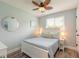 Comfortable bedroom with light blue accents and a decorative ceiling fan at 203 Fox Pl, Port Orange, FL 32127