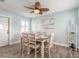 Dining room featuring a decorative fan and a view into the kitchen at 203 Fox Pl, Port Orange, FL 32127