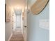 Hallway with multiple doorways and soft blue walls at 203 Fox Pl, Port Orange, FL 32127