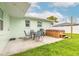 Back patio featuring a patio table with four chairs and a hot tub at 203 Fox Pl, Port Orange, FL 32127