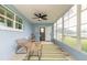 Enclosed sunroom featuring a ceiling fan and view to the exterior at 203 Fox Pl, Port Orange, FL 32127