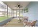 Enclosed sunroom featuring large windows and casual seating at 203 Fox Pl, Port Orange, FL 32127
