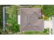 An aerial view showcases the home's roof, landscaping, fenced yard, and proximity to neighboring properties at 218 Wellington Woods Ave, Deland, FL 32724