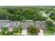 Aerial view of the property displaying its location among lush trees and neighborhood homes with large driveways at 218 Wellington Woods Ave, Deland, FL 32724