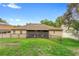 Spacious backyard features a manicured lawn and a secure metal fence, ideal for recreation and privacy at 218 Wellington Woods Ave, Deland, FL 32724