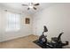 Bedroom featuring exercise bike, ceiling fan, neutral paint and carpet at 218 Wellington Woods Ave, Deland, FL 32724