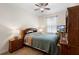 Comfortable bedroom featuring a ceiling fan, and wood furniture at 218 Wellington Woods Ave, Deland, FL 32724