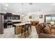 Kitchen and dining area with island, stainless appliances, and easy access to the living room at 218 Wellington Woods Ave, Deland, FL 32724