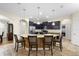 Kitchen with large island, granite countertops, stainless steel appliances, and pendant lighting at 218 Wellington Woods Ave, Deland, FL 32724